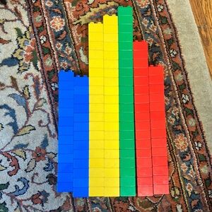 Square Duplos. 26 blue, 39 yellow, 31 red, and 21 green